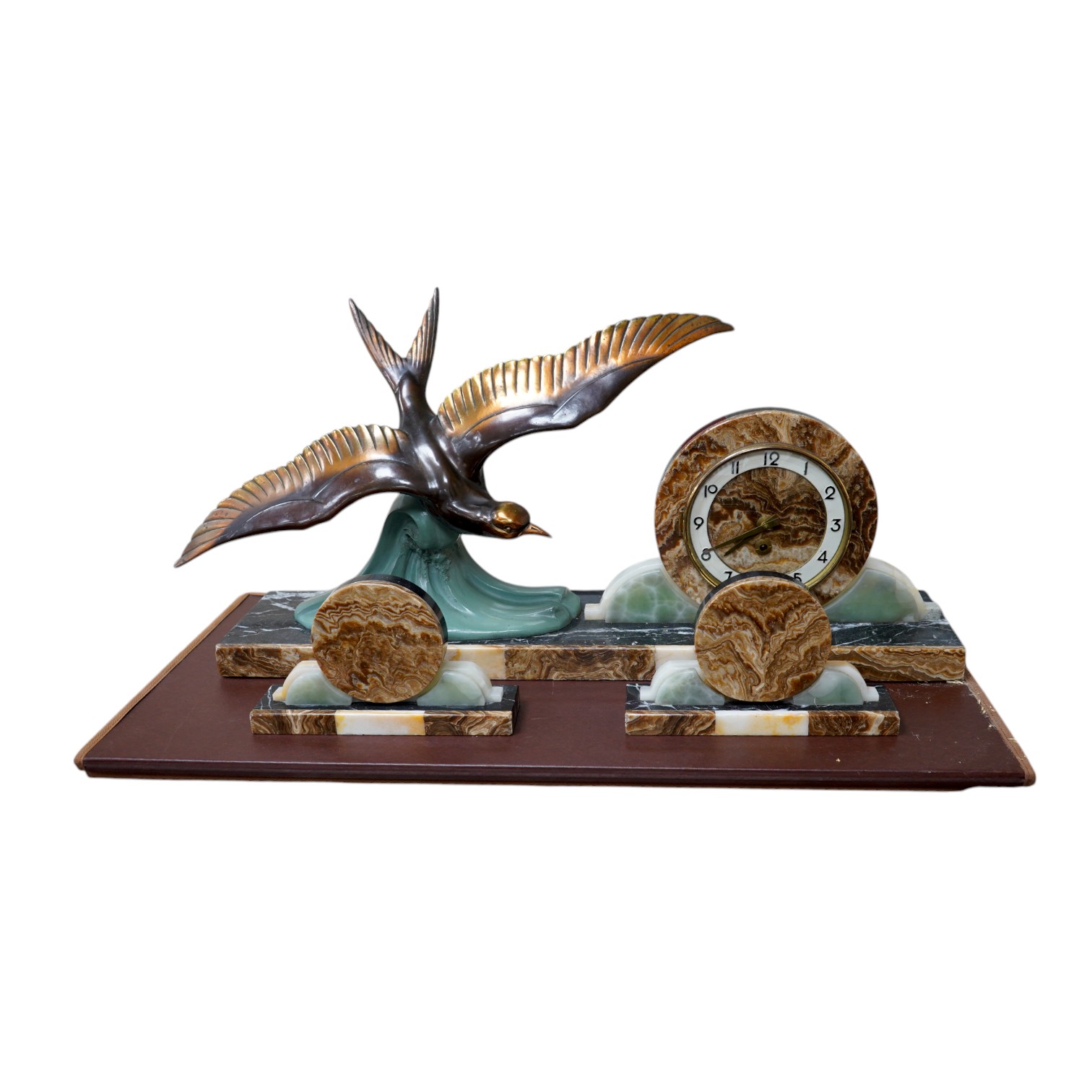 A French Art Deco marble clock garniture surmounted with a stylised spelter seagull, clock 72cm wide. Condition - fair, untested